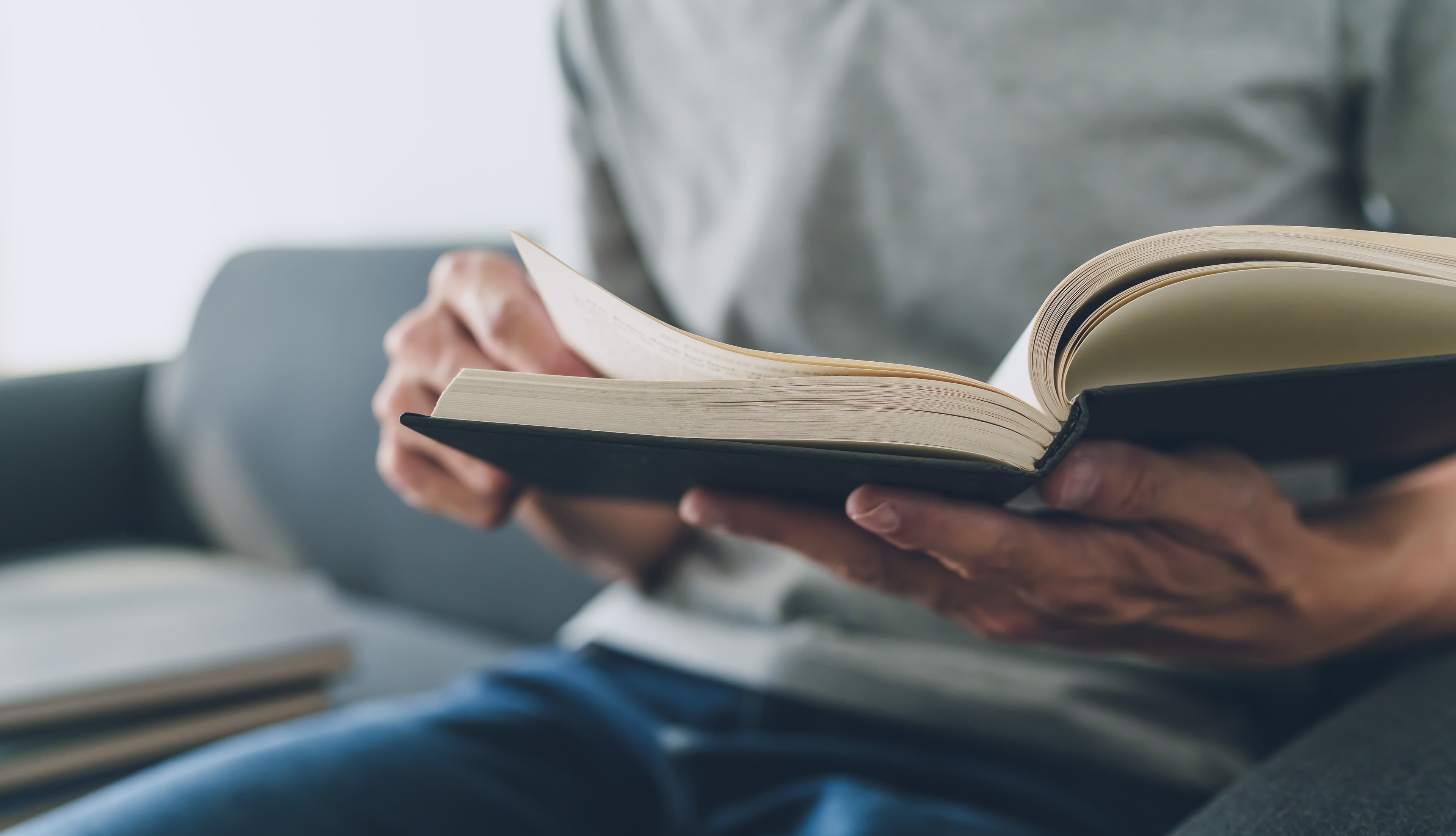 man holding a book in hands